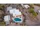 Expansive aerial view showcasing a residence with a private pool, surrounded by desert flora at 612 N Signal Butte Rd, Mesa, AZ 85207
