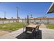 Spacious backyard featuring a lounge area, a hammock, and a table with seating for six at 615 E Mckellips Rd, Tempe, AZ 85288