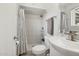This bathroom features a tiled shower with a curtain at 615 E Mckellips Rd, Tempe, AZ 85288