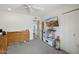 Bedroom featuring a changing table, crib, and play area, offering a versatile space at 615 E Mckellips Rd, Tempe, AZ 85288