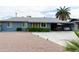 Charming single-story home with a well-manicured yard and a convenient carport at 615 E Mckellips Rd, Tempe, AZ 85288