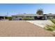 Charming single-story home with a well-manicured yard and a convenient carport at 615 E Mckellips Rd, Tempe, AZ 85288