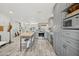 Well-lit kitchen with stainless steel appliances, modern cabinetry, and wood-look floors at 615 E Mckellips Rd, Tempe, AZ 85288