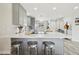 Bright kitchen features a spacious island, modern gray cabinetry and stainless steel barstools at 615 E Mckellips Rd, Tempe, AZ 85288
