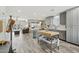 Open-concept kitchen flows seamlessly into the living room with ample counter space at 615 E Mckellips Rd, Tempe, AZ 85288