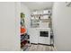 Convenient laundry room with washer, dryer, and ample storage shelving at 615 E Mckellips Rd, Tempe, AZ 85288