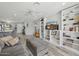 Bright and modern living room features a gray sofa, custom shelves, and stylish decor at 615 E Mckellips Rd, Tempe, AZ 85288