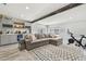 Inviting living room with plush sofa, modern rug, and a convenient wet bar area at 615 E Mckellips Rd, Tempe, AZ 85288
