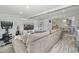 Modern living room features a comfortable sofa and an open view to the connected dining area at 615 E Mckellips Rd, Tempe, AZ 85288