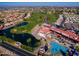 Stunning aerial view of the community with a lush golf course, a pond, and an inviting pool area at 6331 S Cypress Point Dr, Chandler, AZ 85249