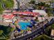 Aerial shot showcasing the community pool, tennis courts, solar panels and nearby parking at 6331 S Cypress Point Dr, Chandler, AZ 85249