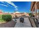 Relaxing backyard has a water feature, seating, and desert landscaping at 6331 S Cypress Point Dr, Chandler, AZ 85249