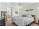 Comfortable bedroom with ensuite bathroom, ceiling fan, and neutral tones, creating a relaxing retreat at 6331 S Cypress Point Dr, Chandler, AZ 85249
