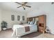 Inviting bedroom with ceiling fan and ample natural light, creating a tranquil and airy atmosphere at 6331 S Cypress Point Dr, Chandler, AZ 85249