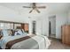 Airy bedroom with ceiling fan, spacious closet and serene atmosphere, perfect for relaxation and rest at 6331 S Cypress Point Dr, Chandler, AZ 85249