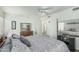 Spacious bedroom with ceiling fan and large dresser for ample storage, complemented by soft decor at 6331 S Cypress Point Dr, Chandler, AZ 85249