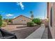The exterior is beautifully landscaped with mature trees and desert rock at 6331 S Cypress Point Dr, Chandler, AZ 85249