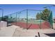 Well-maintained tennis court with green fencing, providing an active lifestyle option at 6331 S Cypress Point Dr, Chandler, AZ 85249