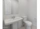 Clean half-bathroom with pedestal sink, toilet, and simple design at 662 W Rock Needle Trl, Apache Junction, AZ 85120