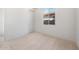 Comfortable carpeted bedroom with closet and window to backyard at 662 W Rock Needle Trl, Apache Junction, AZ 85120