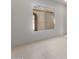 Well-lit bedroom with neutral walls and flooring, with large window allowing natural light at 662 W Rock Needle Trl, Apache Junction, AZ 85120