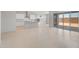 Spacious, open kitchen with modern appliances, a large island, and seamless access to the outdoor patio at 662 W Rock Needle Trl, Apache Junction, AZ 85120