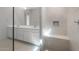 Luxurious bathroom with a spacious vanity, a glass shower with a bench, and modern fixtures at 662 W Rock Needle Trl, Apache Junction, AZ 85120