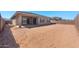 Large backyard with covered patio, ready for your landscaping vision to come to life at 674 W Rock Needle Trl, Apache Junction, AZ 85120