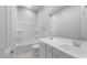 Pristine bathroom with a shower-tub combo, white double sink vanity, and chrome fixtures at 674 W Rock Needle Trl, Apache Junction, AZ 85120
