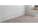 Cozy bedroom featuring neutral carpet, fresh paint, and a window for natural light at 674 W Rock Needle Trl, Apache Junction, AZ 85120