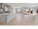Open-concept living area highlighting a sleek kitchen, spacious layout, and abundant natural light at 674 W Rock Needle Trl, Apache Junction, AZ 85120