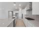 Well-equipped kitchen featuring stainless steel appliances, quartz countertops, and an eat-in island at 674 W Rock Needle Trl, Apache Junction, AZ 85120