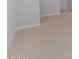 Modern living area showcasing tile flooring, light walls, and a seamless flow into other spaces at 674 W Rock Needle Trl, Apache Junction, AZ 85120