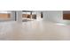 Spacious living area with contemporary tile floors, expansive glass doors, and abundant natural light at 674 W Rock Needle Trl, Apache Junction, AZ 85120