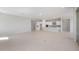 Open concept living room and kitchen area with tile floors, recessed lighting, and neutral paint at 674 W Rock Needle Trl, Apache Junction, AZ 85120