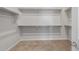 Walk-in closet with ample shelving and carpet flooring for organized storage at 674 W Rock Needle Trl, Apache Junction, AZ 85120
