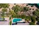Aerial view of a backyard pool and lush vegetation at 6855 E Amber Sun Dr, Scottsdale, AZ 85266