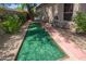 An inviting backyard featuring a bocce ball court and outdoor seating area at 6855 E Amber Sun Dr, Scottsdale, AZ 85266