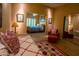 An open bedroom leading to another with neutral walls and an adjoining bedroom at 6855 E Amber Sun Dr, Scottsdale, AZ 85266