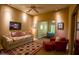 An open bedroom leading to another with neutral walls and soft lighting at 6855 E Amber Sun Dr, Scottsdale, AZ 85266