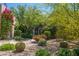 A drought-tolerant front yard featuring cacti and flowering bushes at 6855 E Amber Sun Dr, Scottsdale, AZ 85266