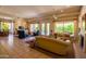Expansive living area connecting dining and lounge spaces with abundant natural light and modern décor at 6855 E Amber Sun Dr, Scottsdale, AZ 85266