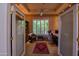 Office featuring custom built-ins, a large window with shutters, and stylish furnishings at 6855 E Amber Sun Dr, Scottsdale, AZ 85266