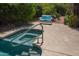 A backyard pool with tiled edges and a seating area provides a refreshing oasis at 6855 E Amber Sun Dr, Scottsdale, AZ 85266