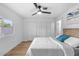 Bedroom featuring a bed, ceiling fan, and new floors at 7836 E Juanita Ave, Mesa, AZ 85208