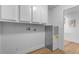 Well-lit laundry room with ample cabinet space and modern appliances at 7836 E Juanita Ave, Mesa, AZ 85208