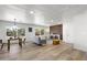 Open-plan living room featuring abundant light, wood floors, and modern contemporary decor at 7836 E Juanita Ave, Mesa, AZ 85208