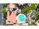 A birds eye view of a community pool with pristine landscaping and a covered lounge area for residents at 8260 E Arabian Trl # 257, Scottsdale, AZ 85258