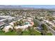 A wide aerial view of the neighborhood showing beautiful landscape and distant mountains on a clear day at 8260 E Arabian Trl # 257, Scottsdale, AZ 85258