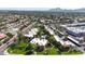 A serene aerial perspective showcasing residential buildings with lush greenery against a mountainous backdrop at 8260 E Arabian Trl # 257, Scottsdale, AZ 85258